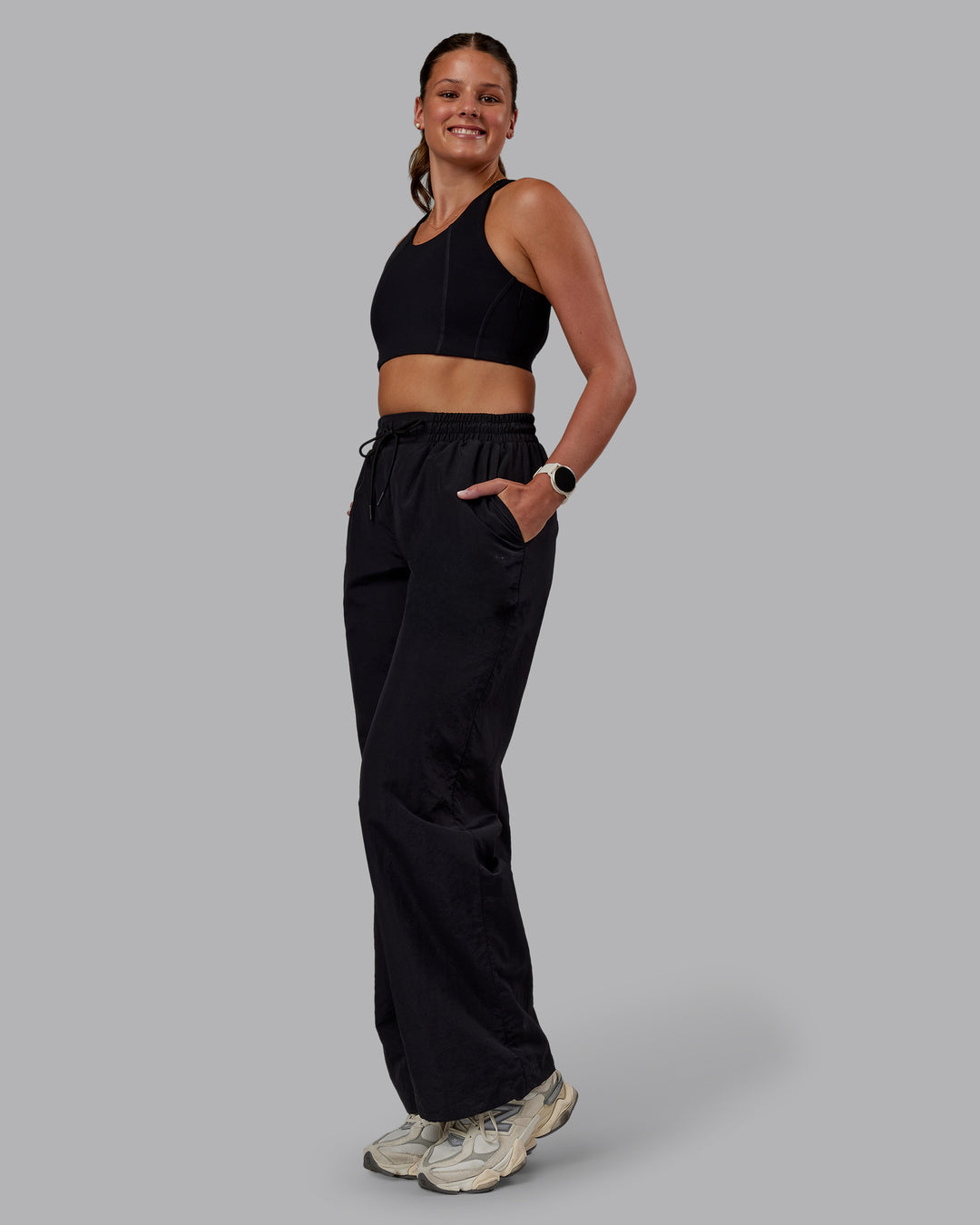 Woman wearing Ignite Parachute Pant - Black | Model:Phoebe | Size:S