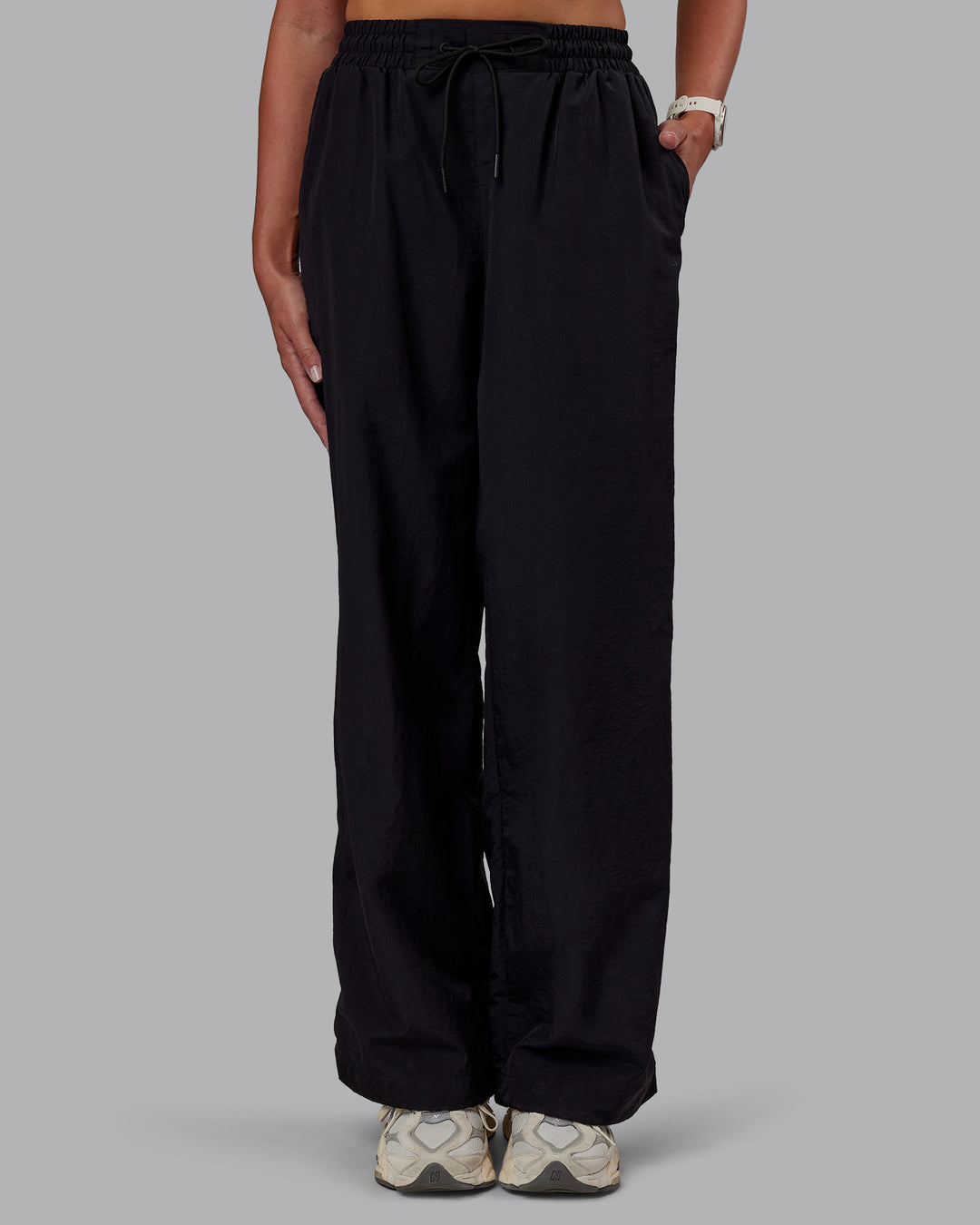 Woman wearing Ignite Parachute Pant - Black | Model:Phoebe | Size:S