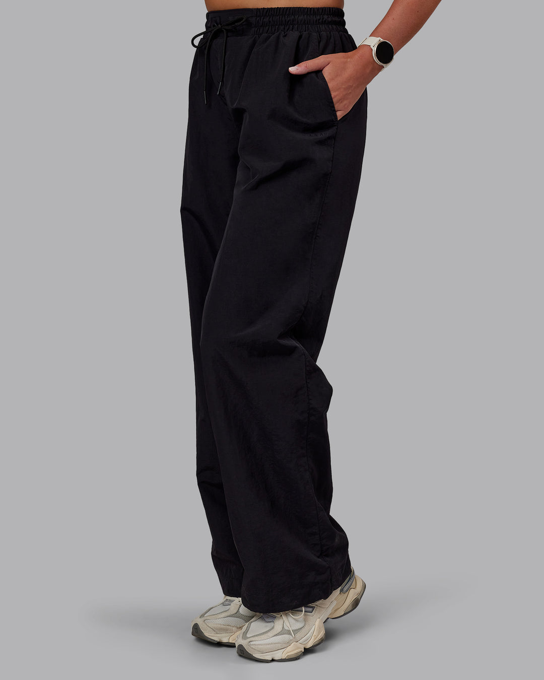 Woman wearing Ignite Parachute Pant - Black | Model:Phoebe | Size:S
