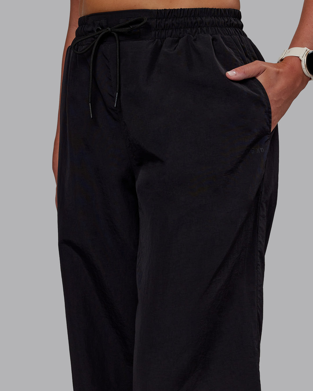 Woman wearing Ignite Parachute Pant - Black | Model:Phoebe | Size:S