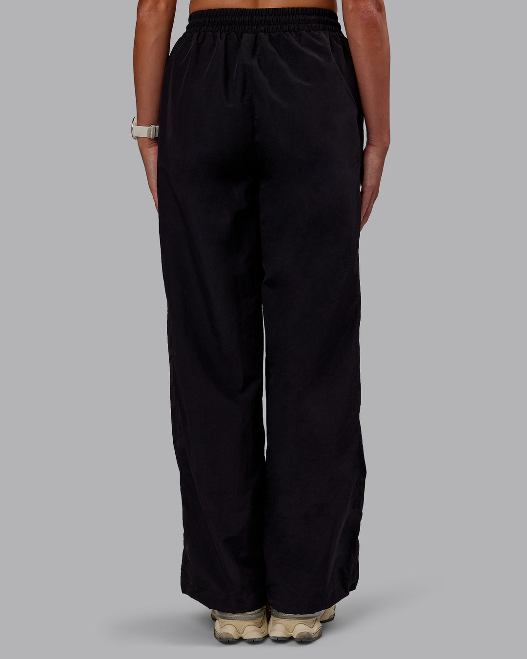 Woman wearing Ignite Parachute Pant - Black | Model:Phoebe | Size:S
