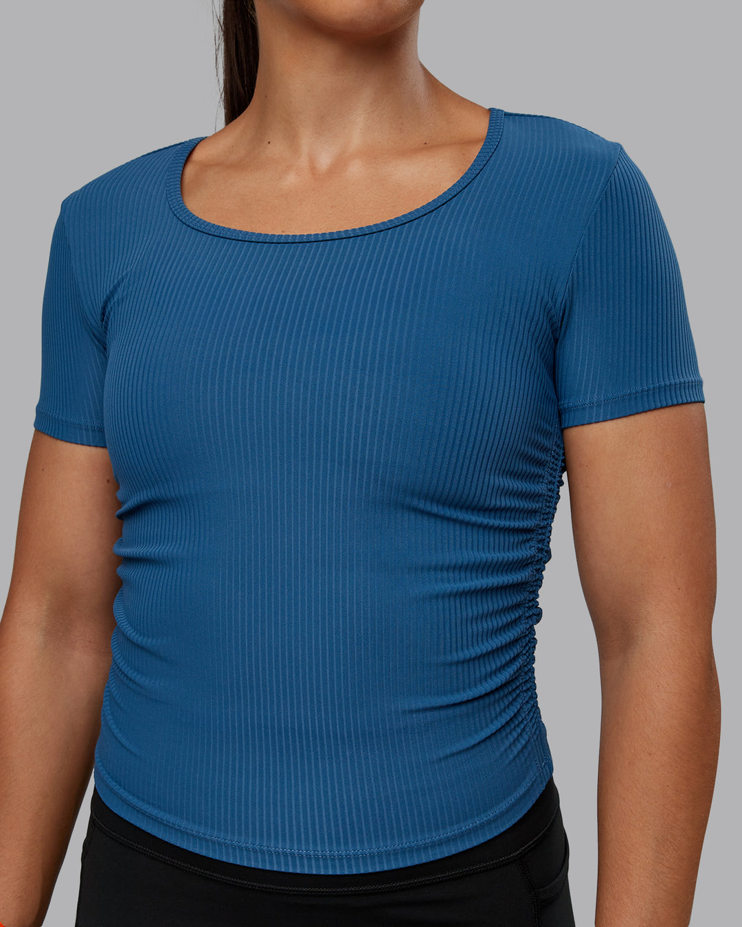 Woman wearing Ignite Ribbed Scrunch Side Cropped Tee - Indigo | Size:S | Model:Tylah