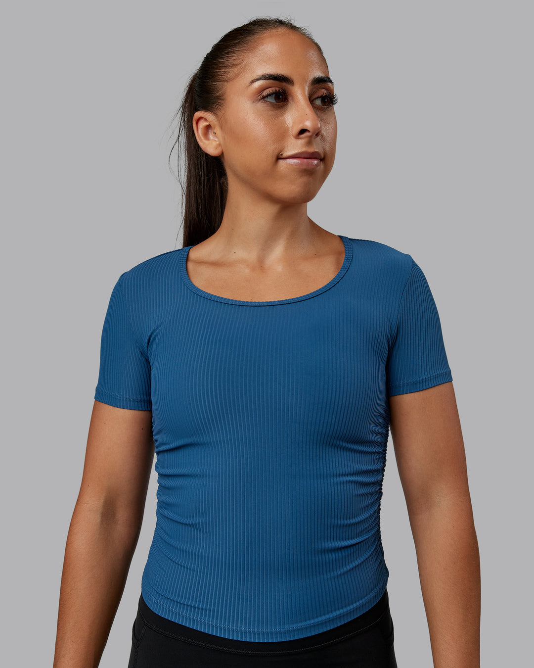 Woman wearing Ignite Ribbed Scrunch Side Cropped Tee - Indigo | Size:S | Model:Tylah
