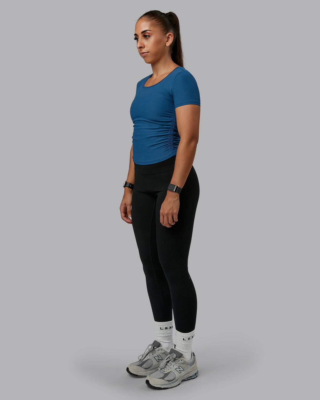 Woman wearing Ignite Ribbed Scrunch Side Cropped Tee - Indigo | Size:S | Model:Tylah