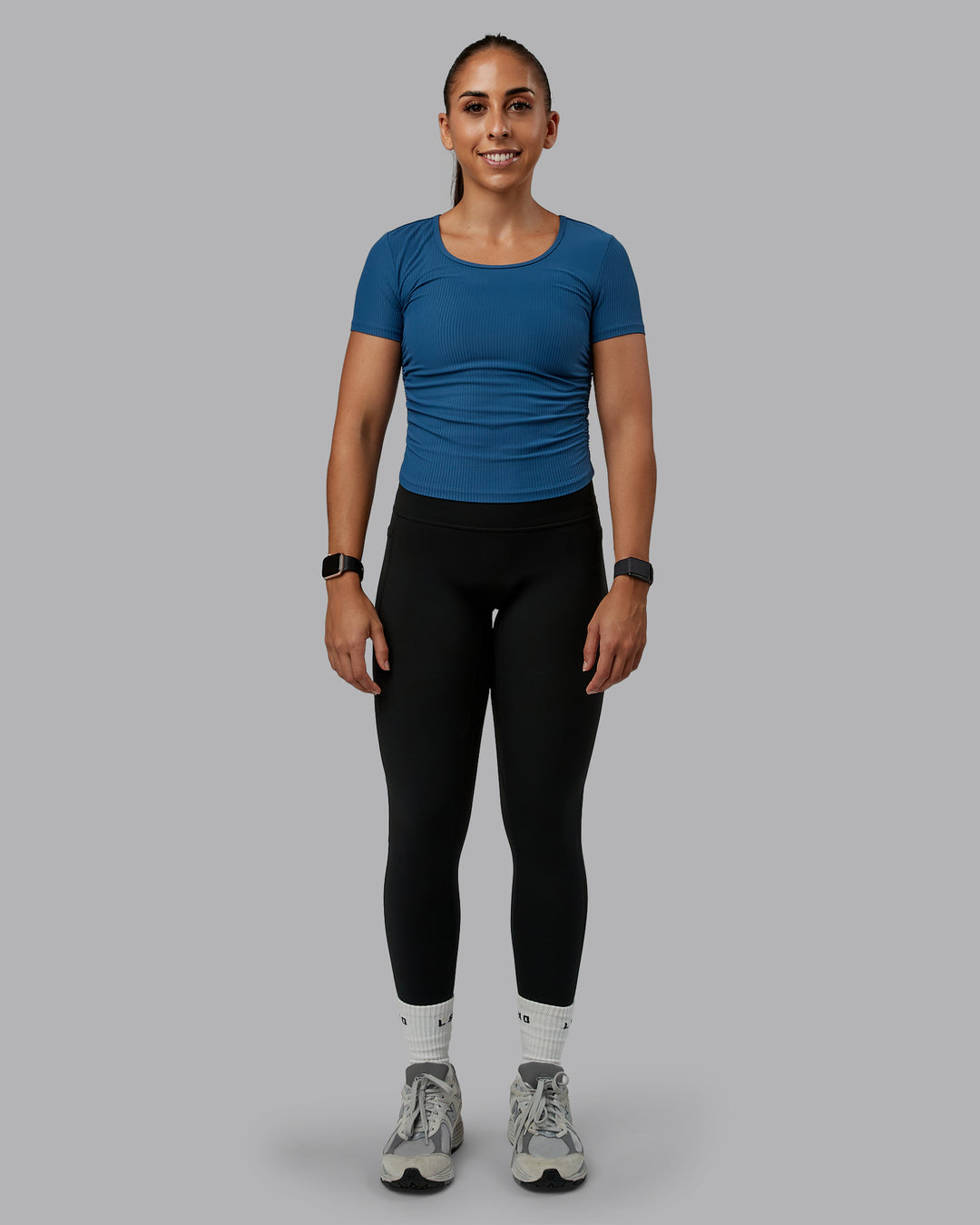 Woman wearing Ignite Ribbed Scrunch Side Cropped Tee - Indigo | Size:S | Model:Tylah