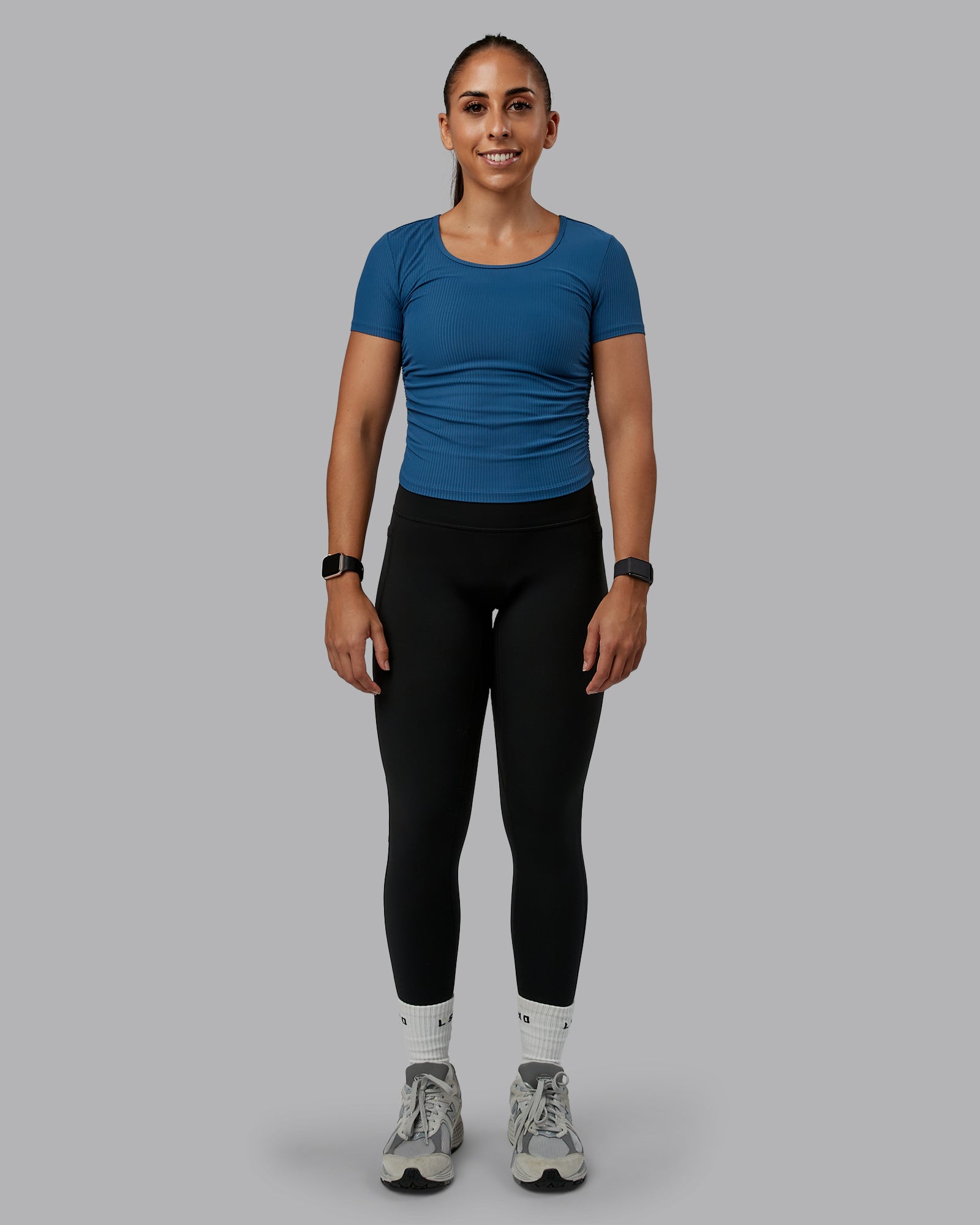 Woman wearing Ignite Ribbed Scrunch Side Cropped Tee - Indigo | Size:S | Model:Tylah