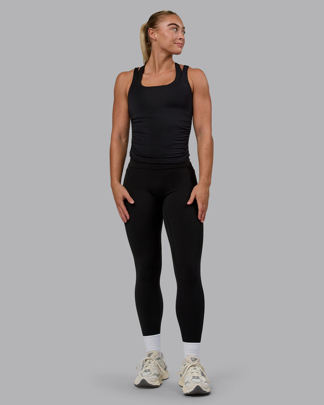 Woman wearing Ignite Scrunch Side Tank - Black