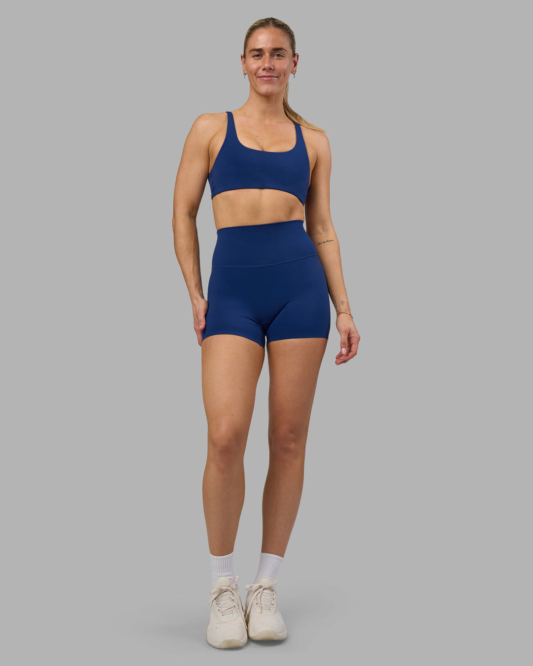 Woman wearing Impulse Reversible Sports Bra - Midnight Blue | Model:Hannah | Size:S - view 5