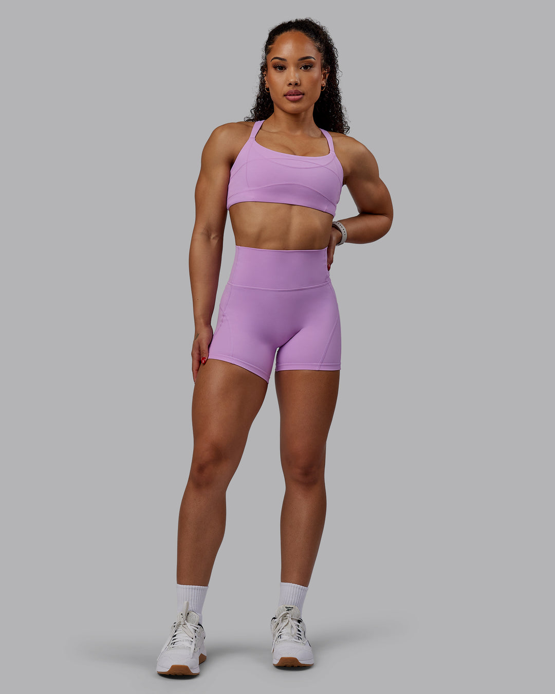 Woman wearing Inertia Sports Bra - Light Violet
