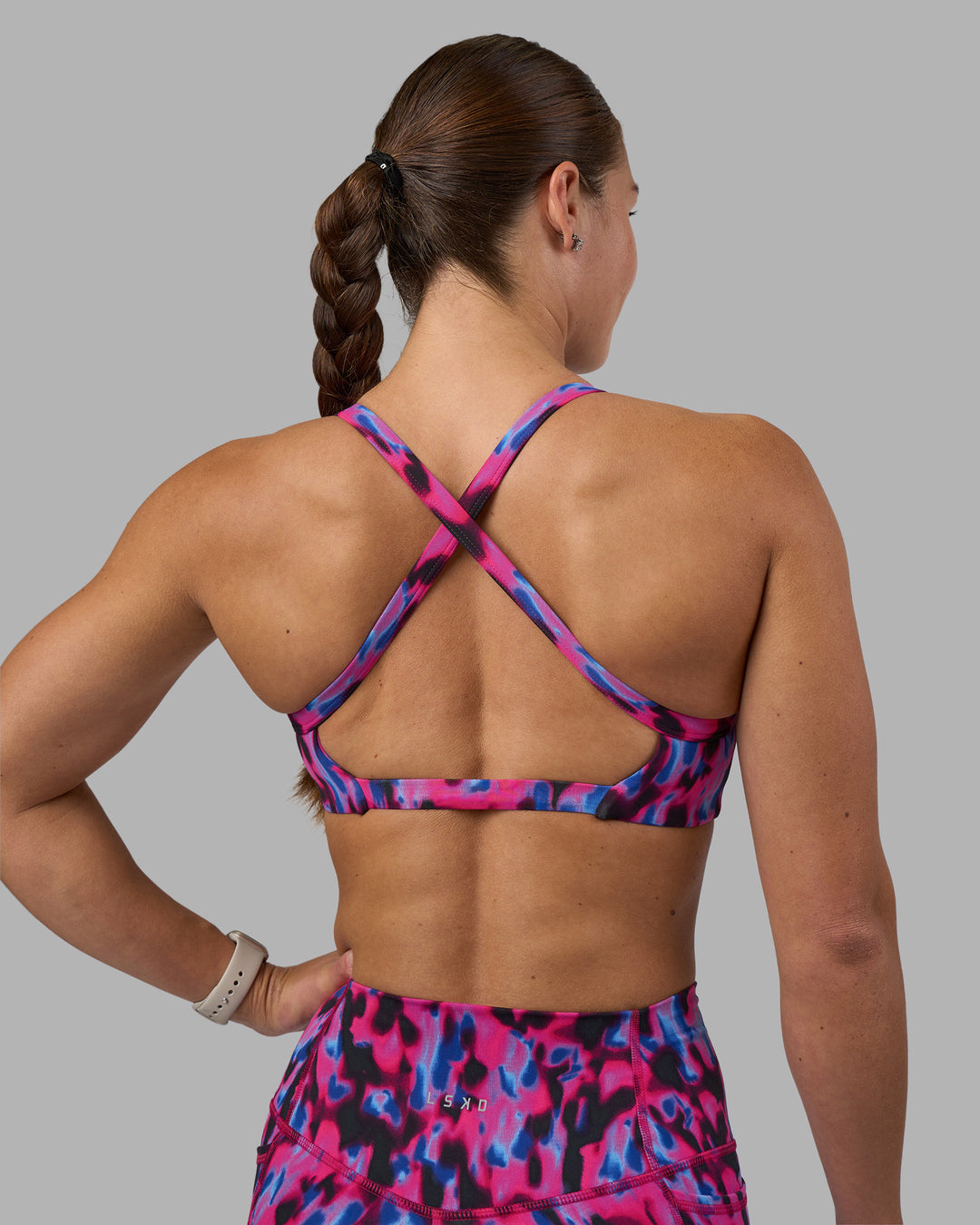 Woman wearing Inspired Sports Bra - Pink Luminous | Model:Hannah | Size:S