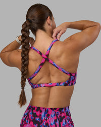 Woman wearing Inspired Sports Bra - Pink Luminous | Model:Hannah | Size:S