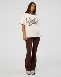 Woman wearing LSKD Fitness Club Heavyweight Oversized Tee - Off White-Cocoa Powder | Model:Bianca | Size:S
