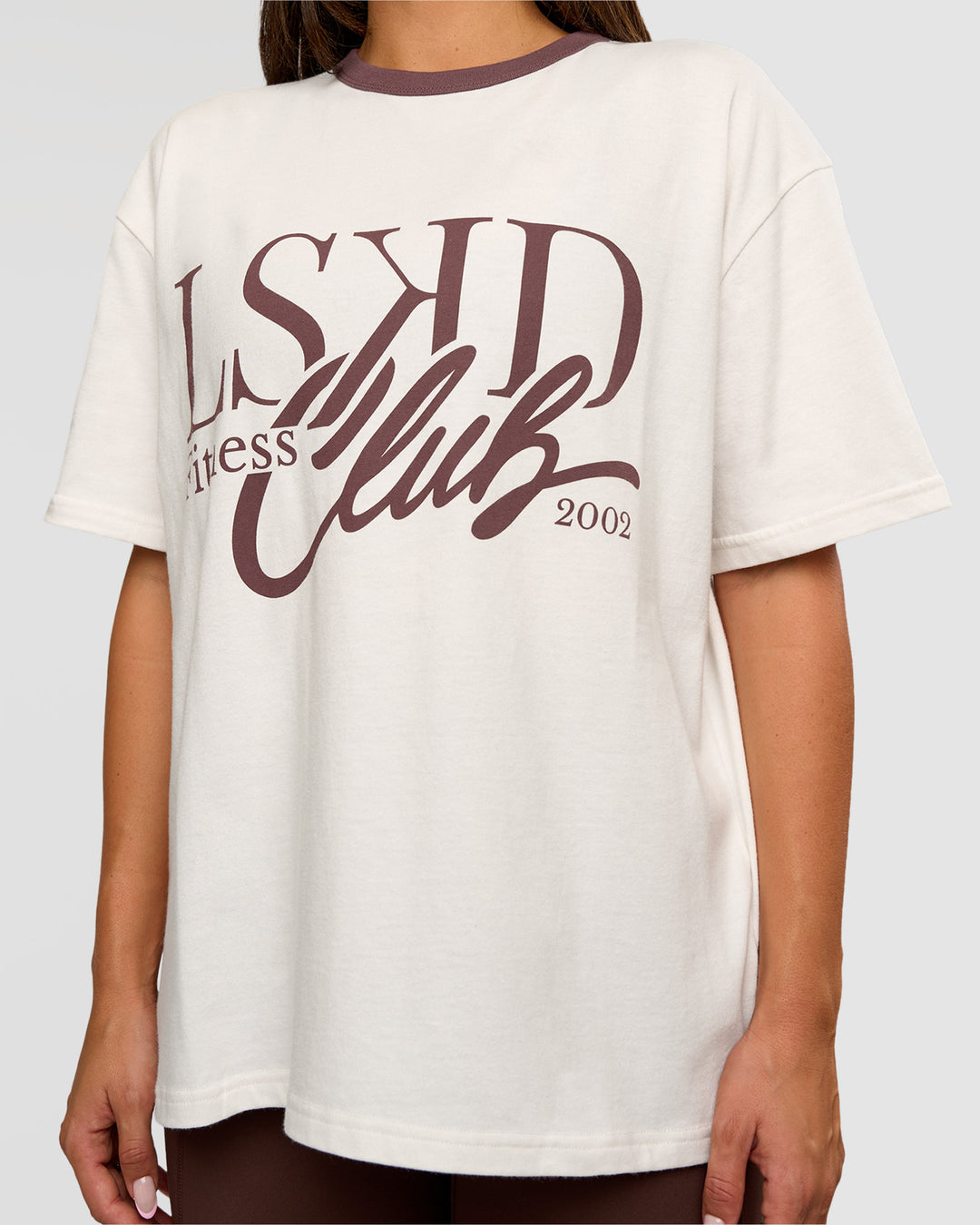 Woman wearing LSKD Fitness Club Heavyweight Oversized Tee - Off White-Cocoa Powder | Model:Bianca | Size:S