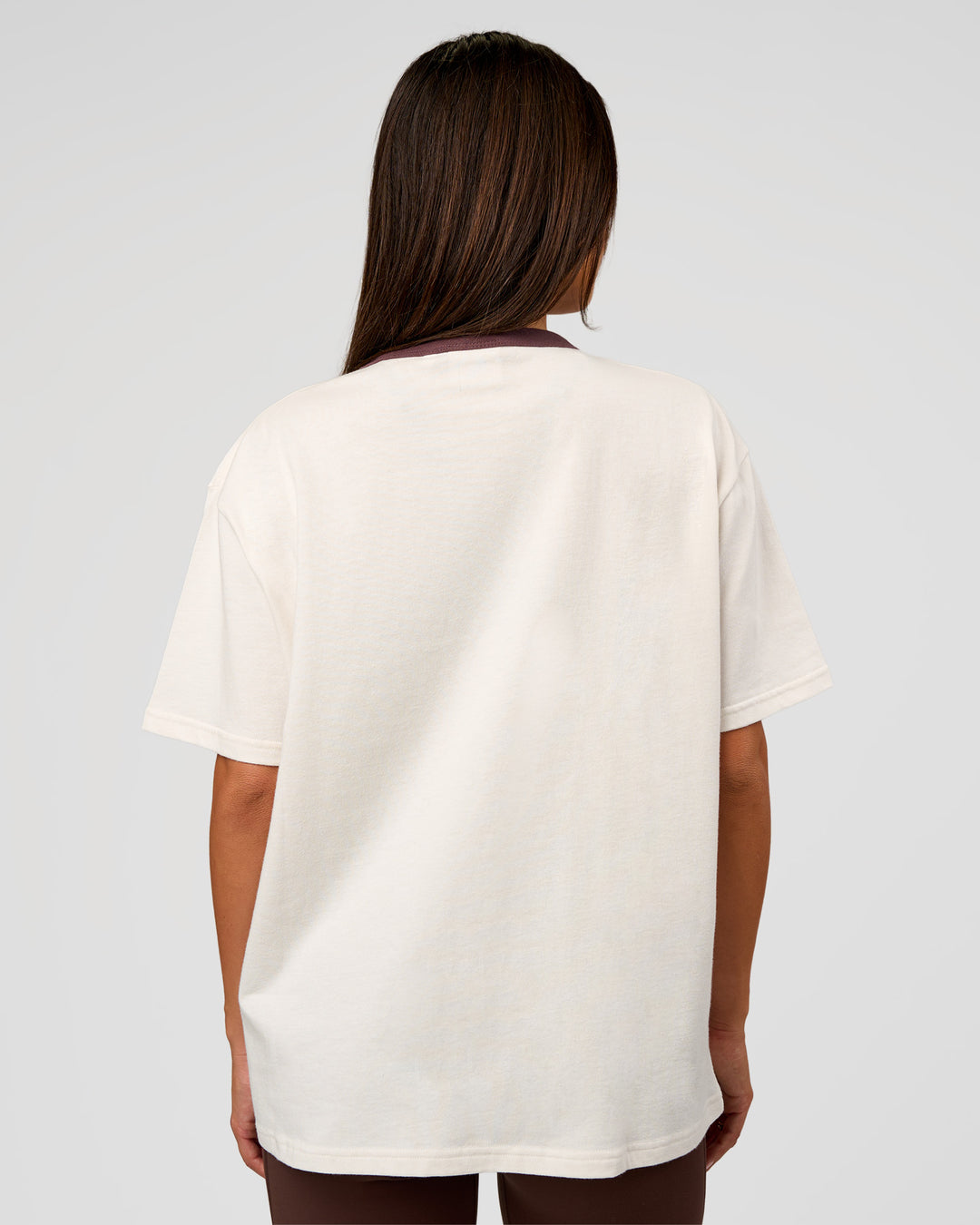 Woman wearing LSKD Fitness Club Heavyweight Oversized Tee - Off White-Cocoa Powder | Model:Bianca | Size:S