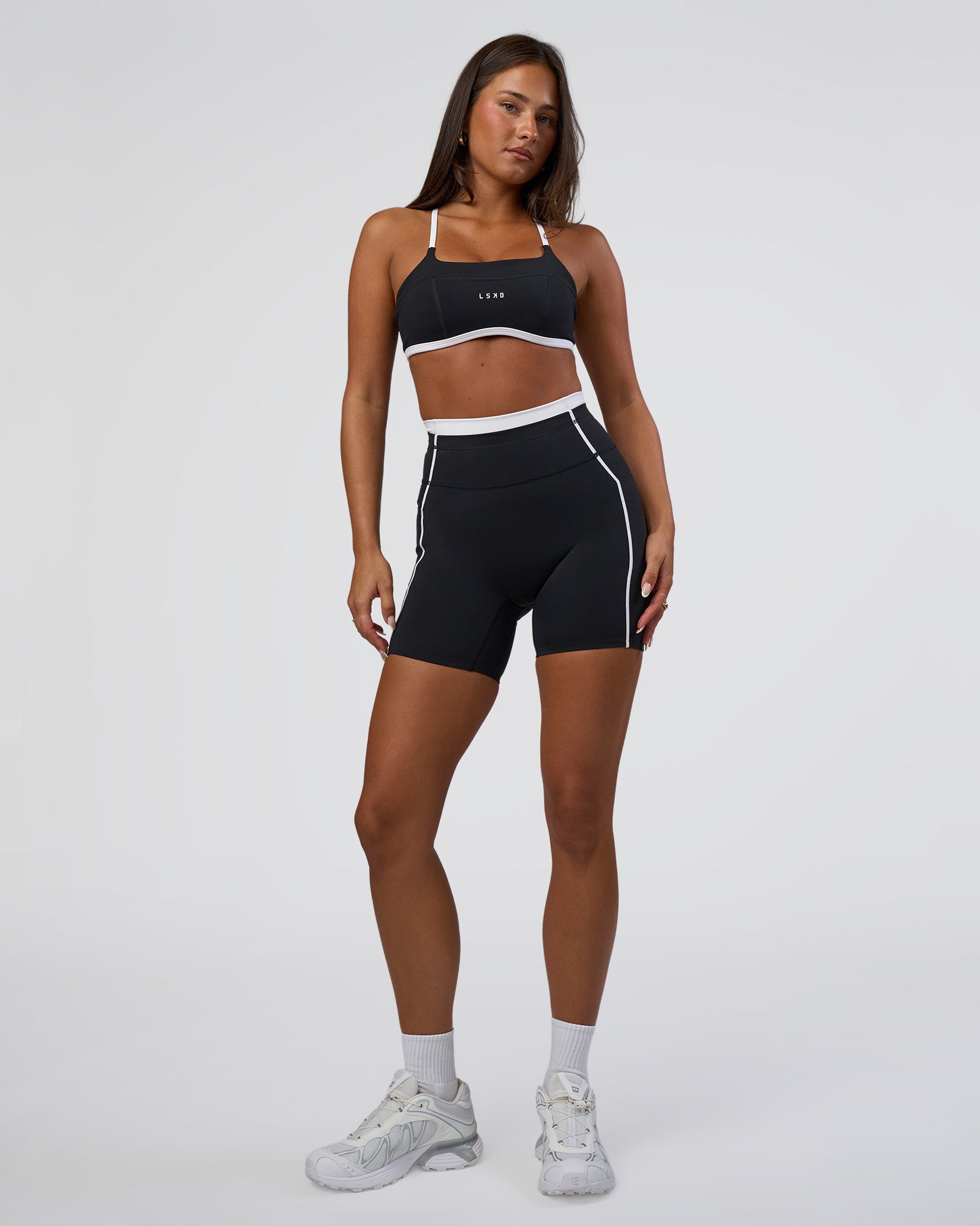 Woman wearing Liberate Contrast High-Rise 6" Short Pockets - Black-White | Model:Bianca | Size:S