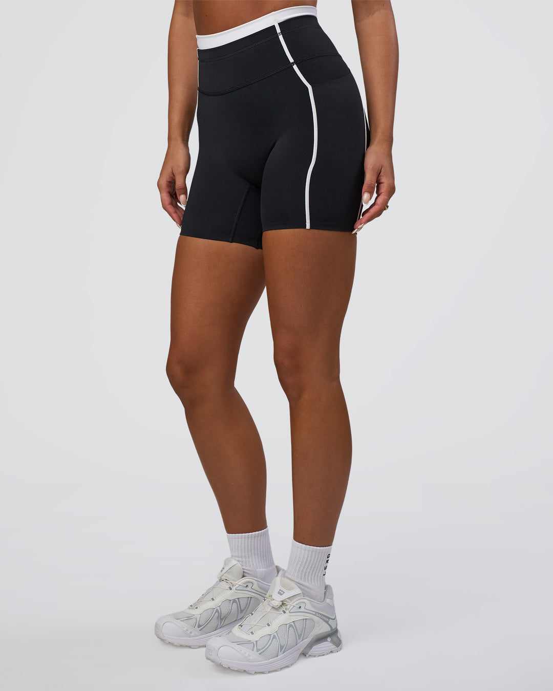 Woman wearing Liberate Contrast High-Rise 6" Short Pockets - Black-White | Model:Bianca | Size:S