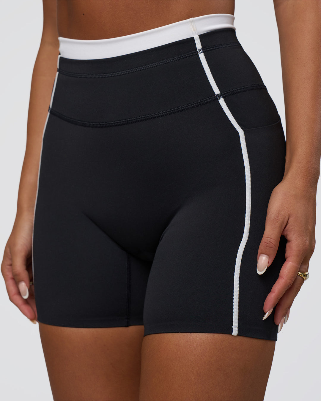 Woman wearing Liberate Contrast High-Rise 6&quot; Short Pockets - Black-White | Model:Bianca | Size:S