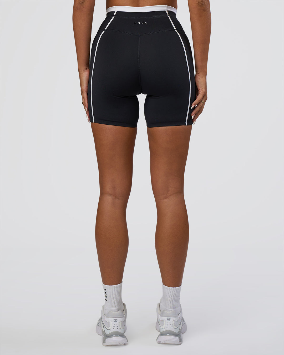 Woman wearing Liberate Contrast High-Rise 6&quot; Short Pockets - Black-White | Model:Bianca | Size:S
