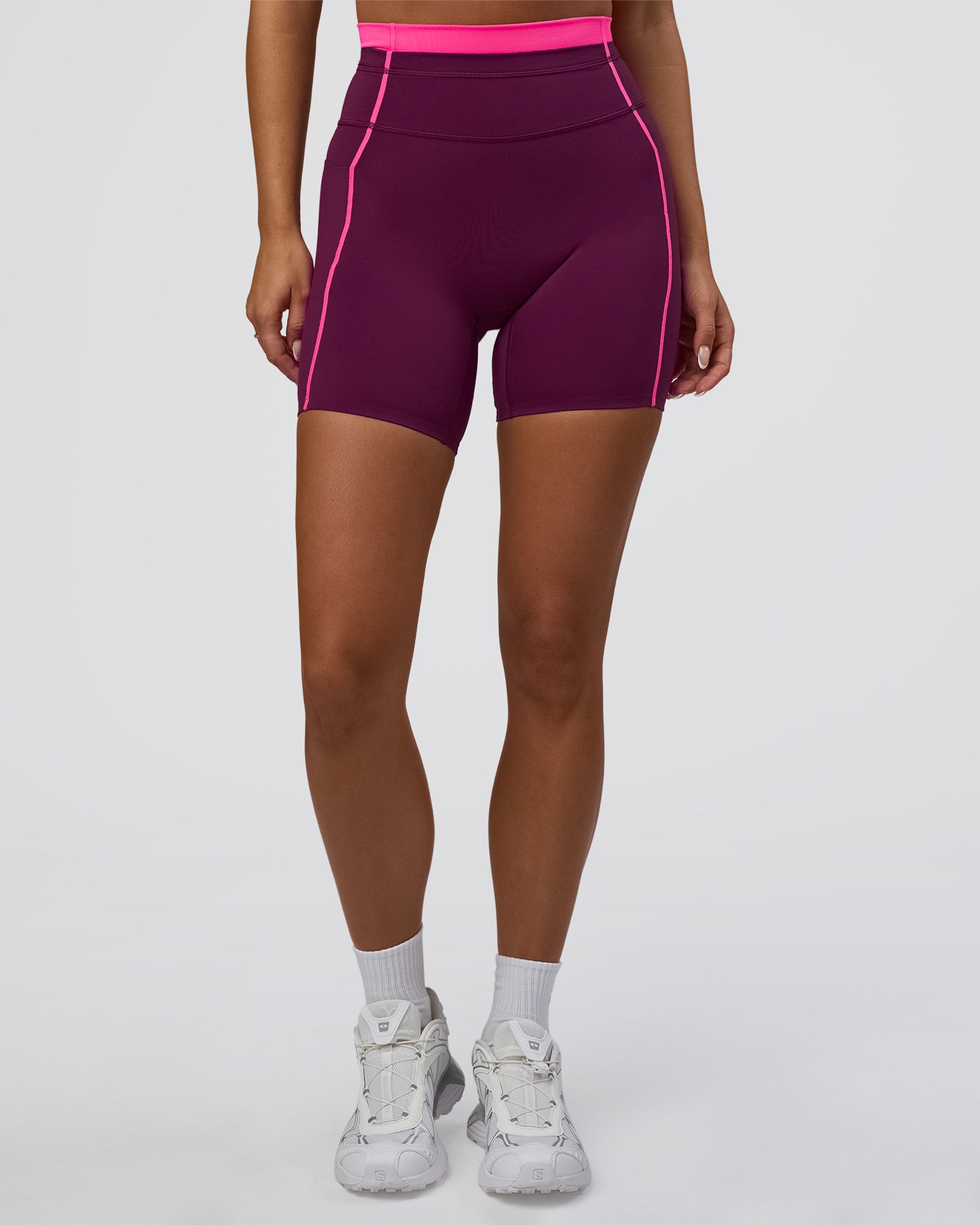 Woman wearing Liberate Contrast High-Rise 6" Short Pockets - Plum Caspia-Ultra Pink | Model:Bianca | Size:S