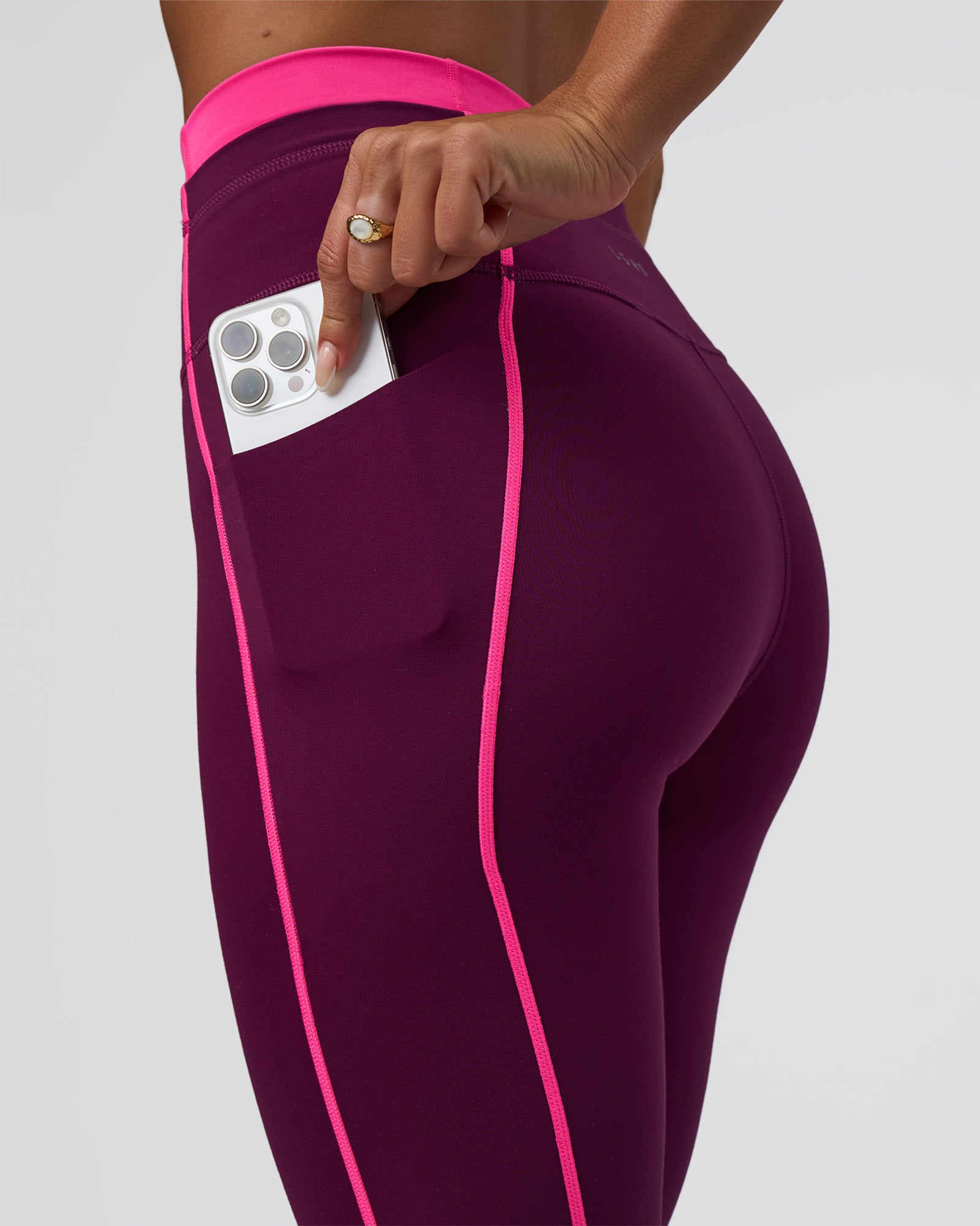 Woman wearing Liberate Contrast High-Rise Full Length Legging Pockets - Plum Caspia-Ultra Pink | Model:Bianca | Size:S