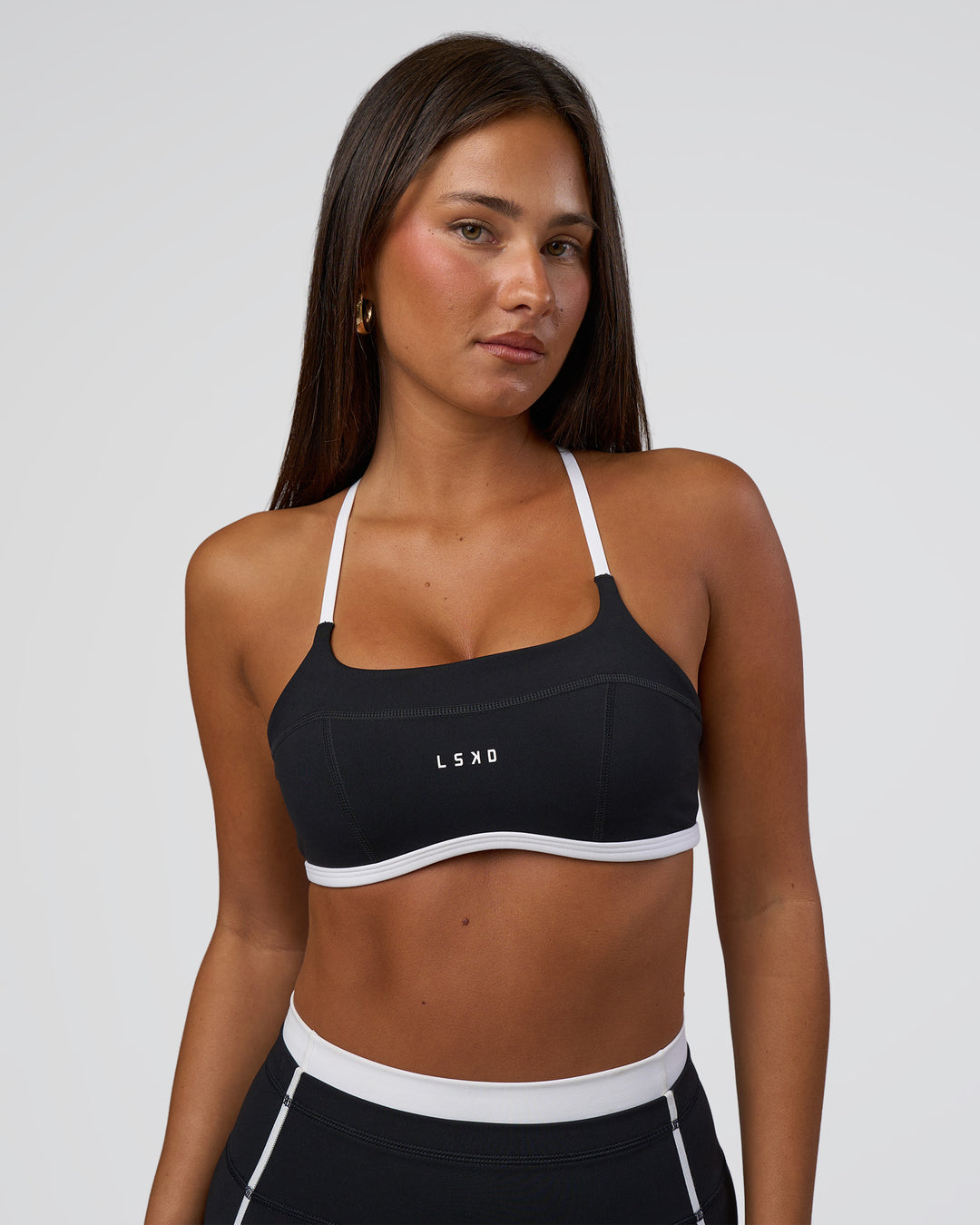 Woman wearing Liberate Sports Bra - Black-White | Model:Bianca | Size:S