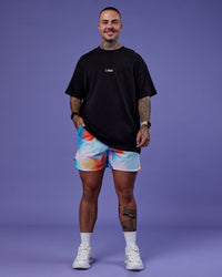 Model wearing Lift 6" Short - Rainbow Shade Print | Model:Tayden | Size:S