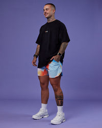 Model wearing Lift 6" Short - Rainbow Shade Print | Model:Tayden | Size:S