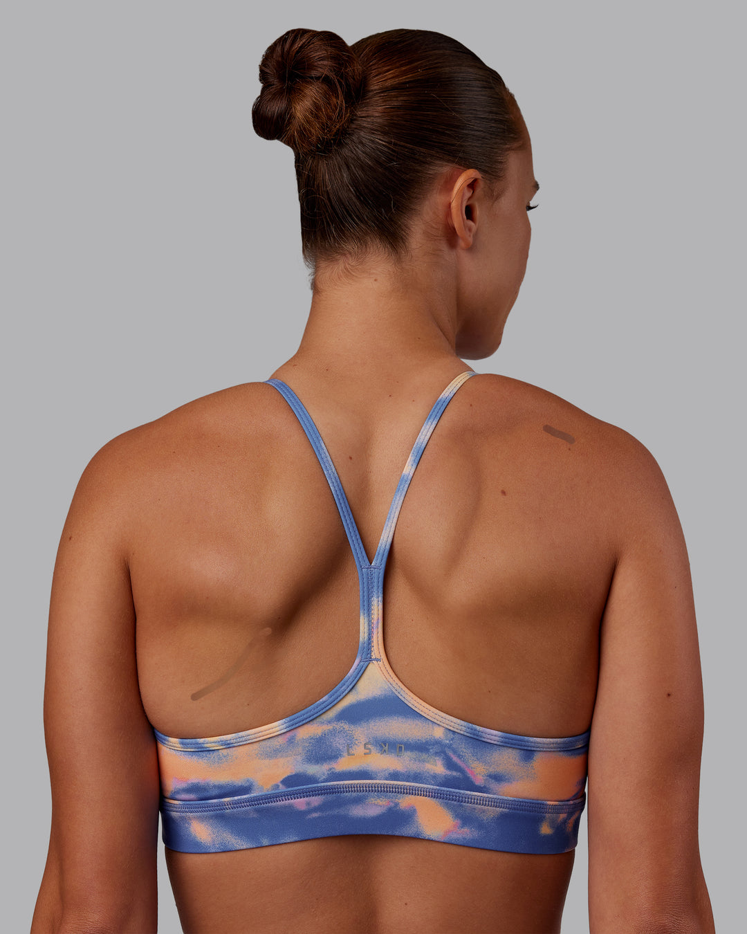Woman wearing Lift High Neck Sports Bra - Apricot Mist | Model:Charlize | Size:S