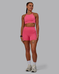 Woman wearing Lift High Neck Sports Bra - Hot Pink