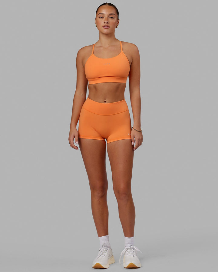 Woman wearing Lift Sports Bra - Tangerine