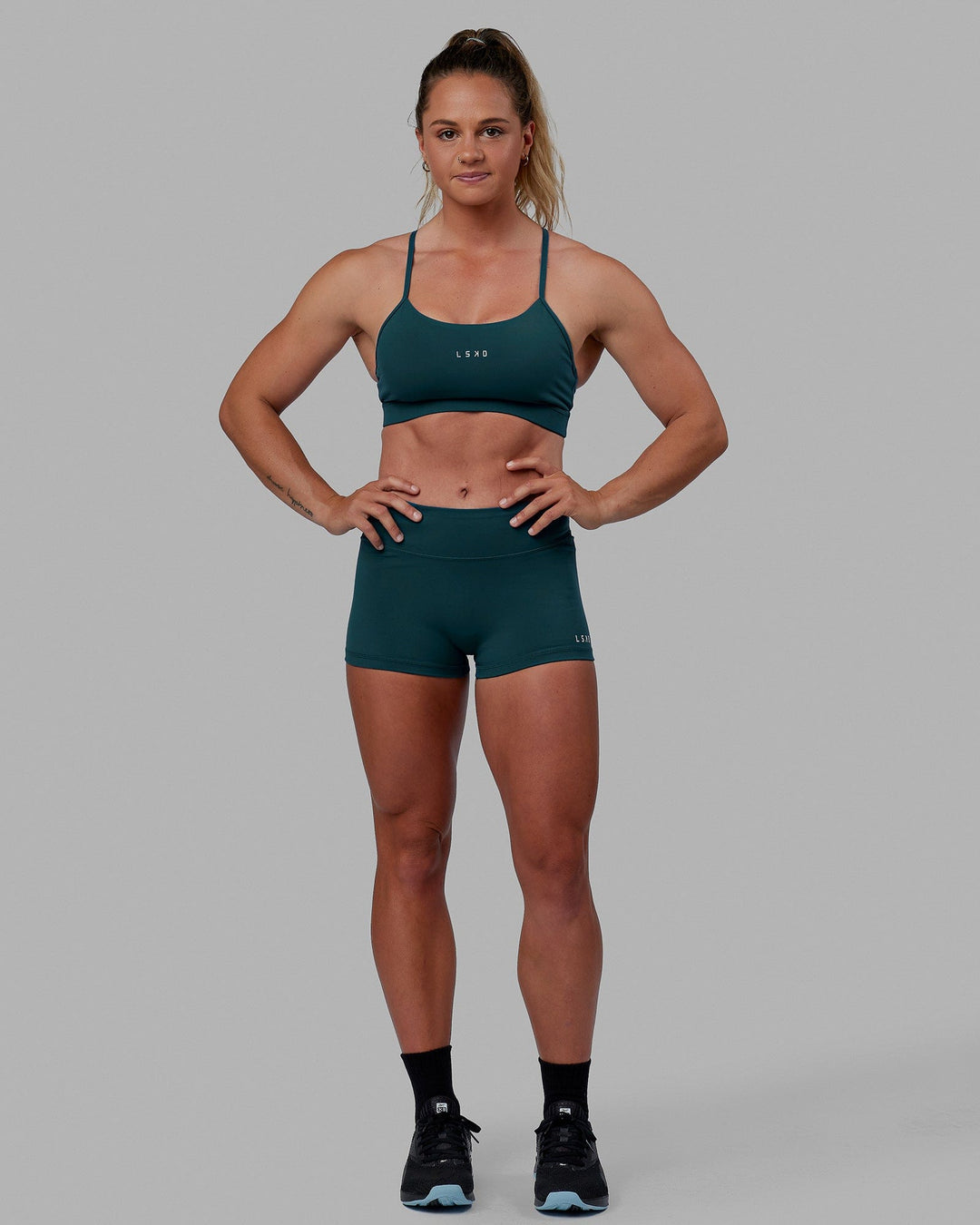 Woman wearing Lift Sports Bra - Tidal Teal