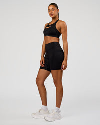 Woman wearing LimitLift Sports Bra - Black | Model:Rosie | Size:S