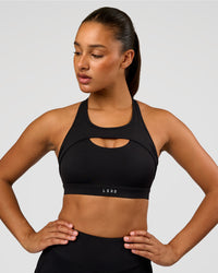 Woman wearing LimitLift Sports Bra - Black | Model:Rosie | Size:S