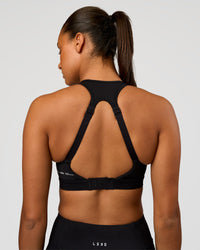 Woman wearing LimitLift Sports Bra - Black | Model:Rosie | Size:S