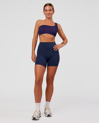 Woman wearing Lively Seamless Ribbed Sports Bra - Future Navy-Ultra Fuchsia | Model:Amity | Size:S