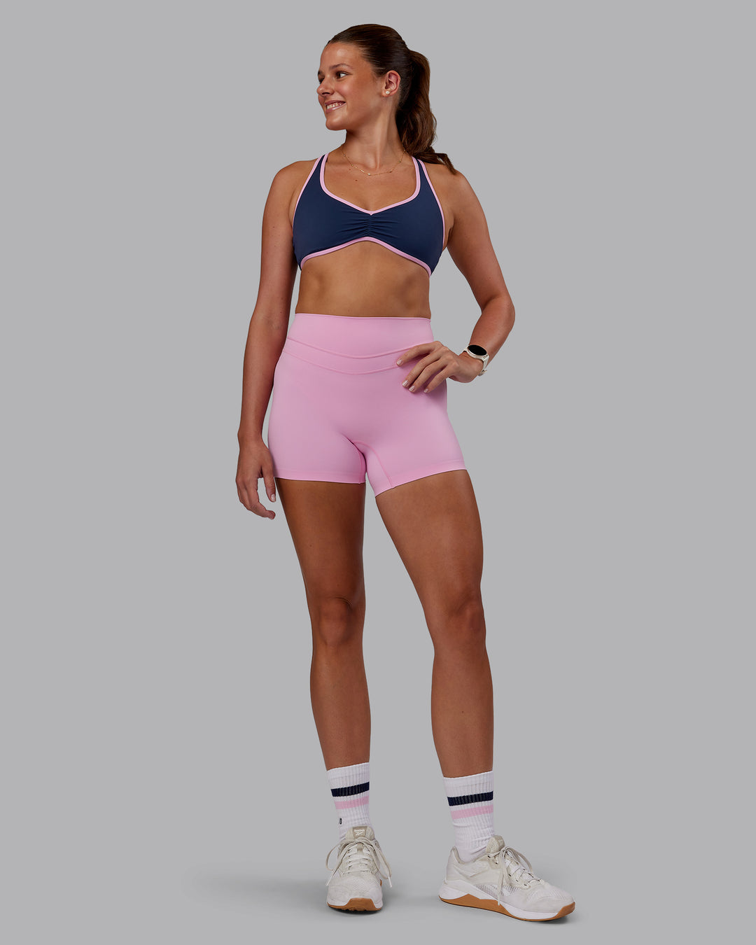 Woman wearing Love Her Wild Sports Bra - Future Navy-Pink Frosting | Model:Phoebe | Size:S