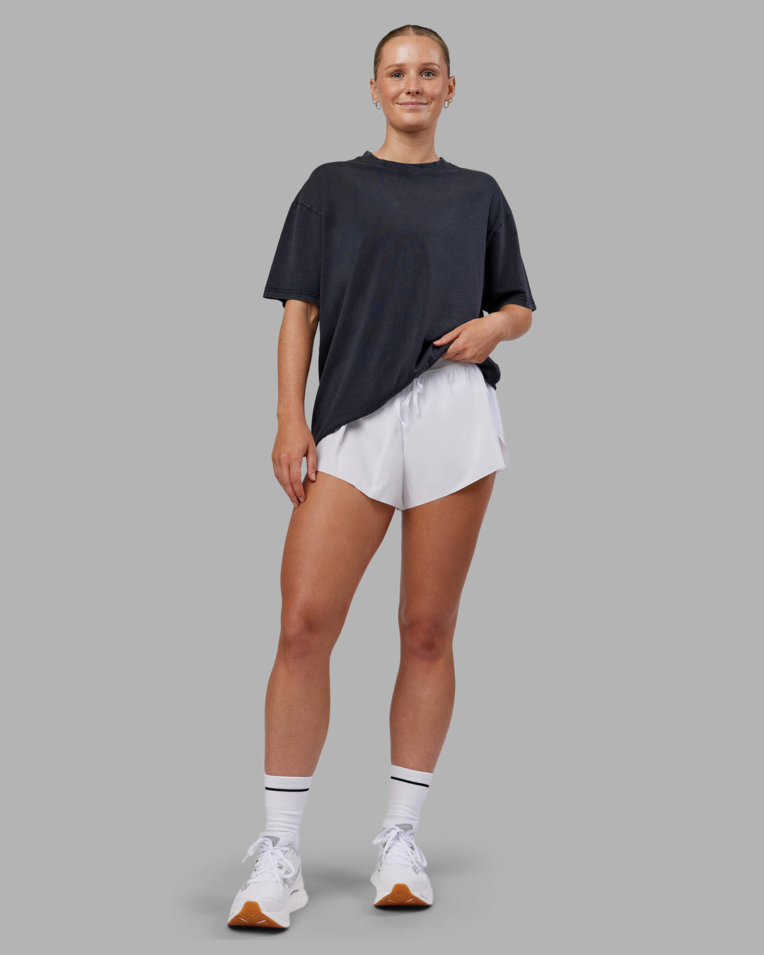 Woman wearing Love The Run FLXCotton Tee Oversize - Black Washed-Circular Grey | Model:Neve | Size:S