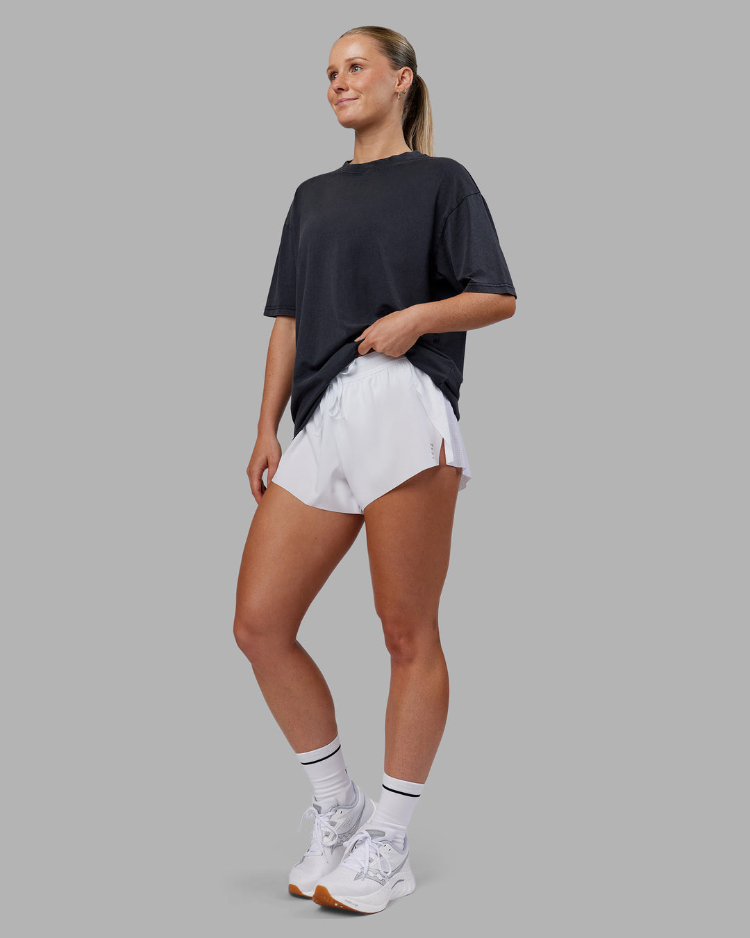 Woman wearing Love The Run FLXCotton Tee Oversize - Black Washed-Circular Grey | Model:Neve | Size:S