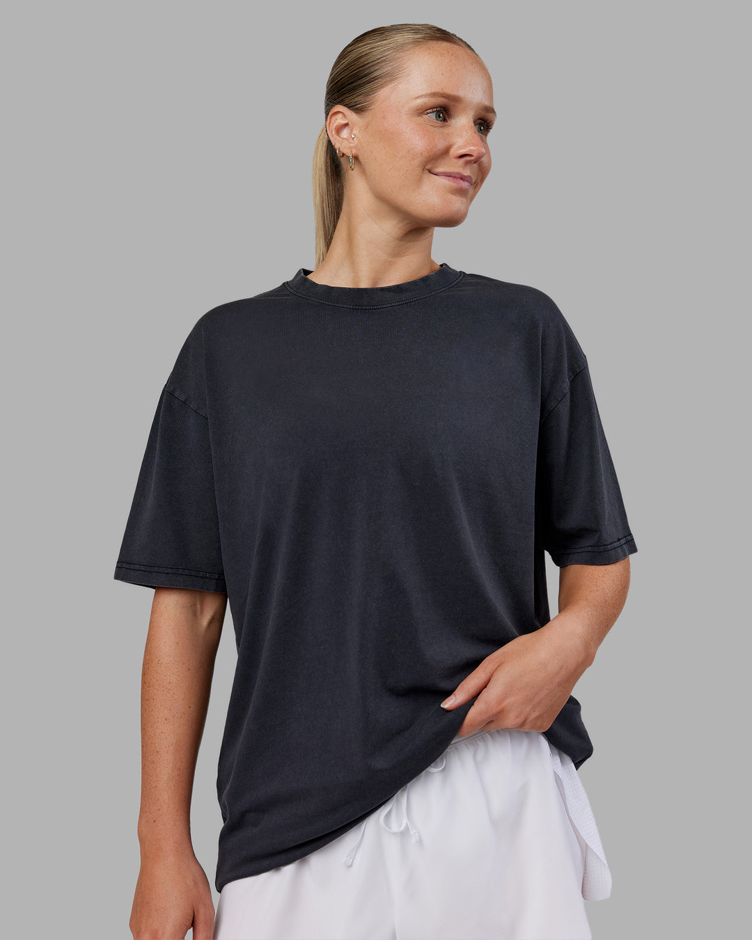 Woman wearing Love The Run FLXCotton Tee Oversize - Black Washed-Circular Grey | Model:Neve | Size:S