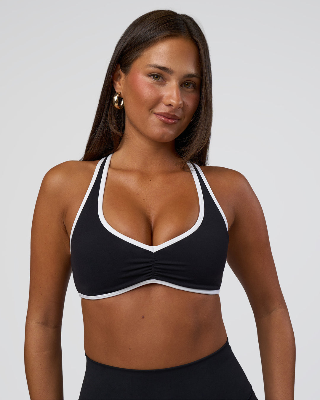 Woman wearing Luminous Sports Bra - Black-White | Model:Bianca | Size:S