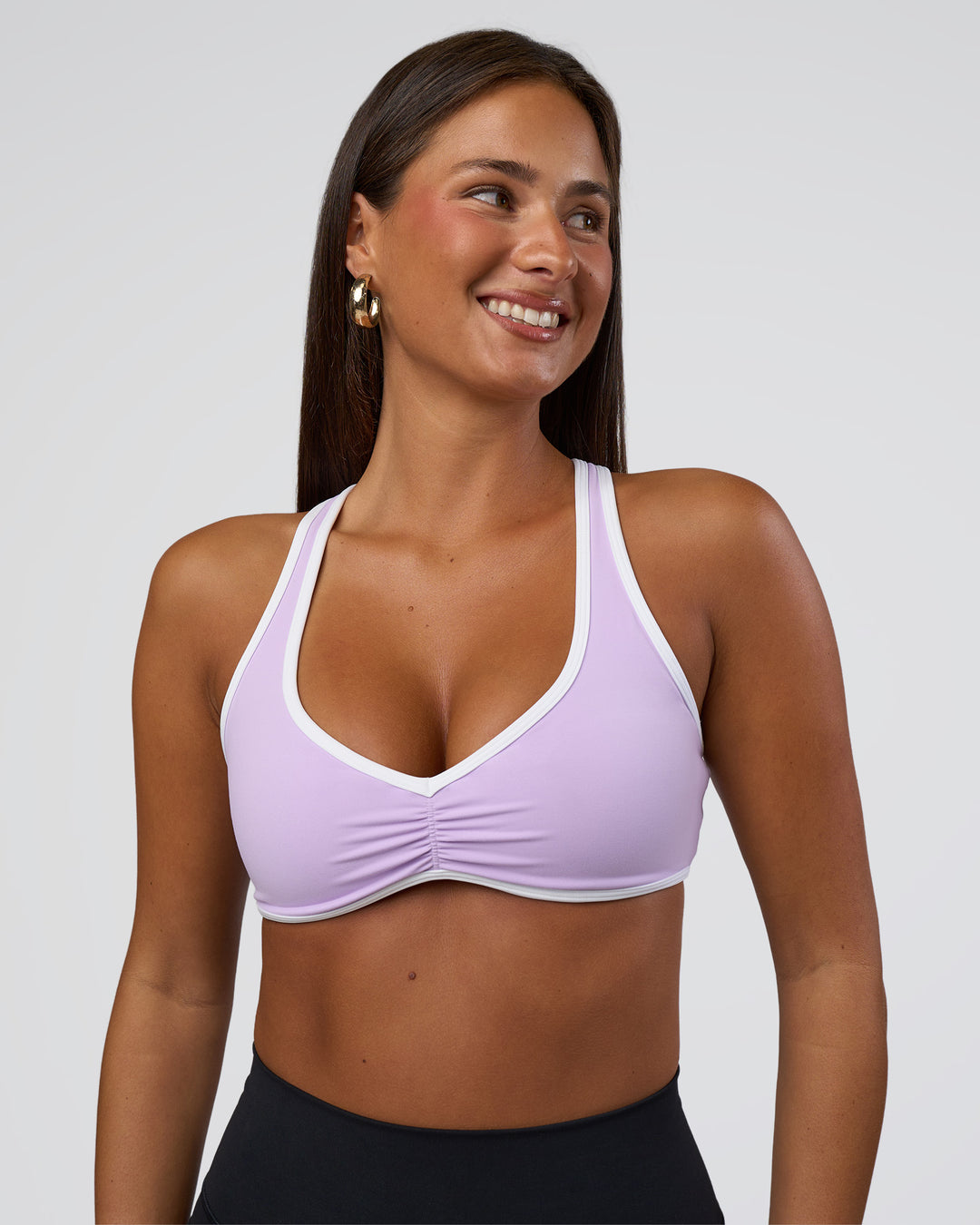 Woman wearing Luminous Sports Bra - Pale Lilac-White | Model:Bianca | Size:S