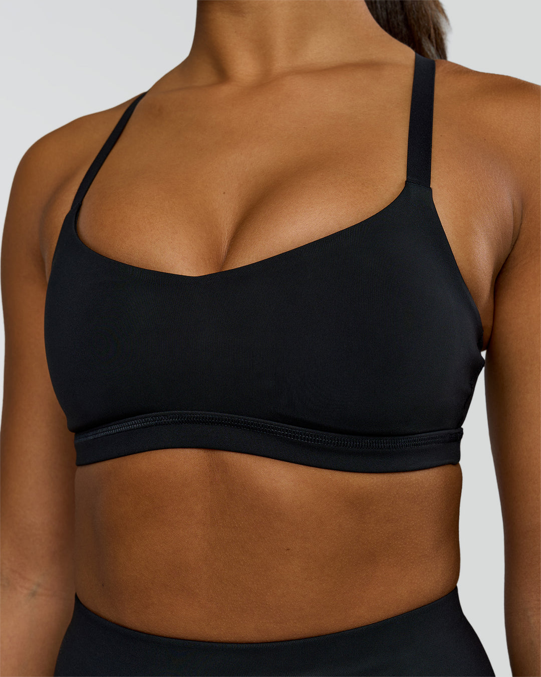 Woman wearing Luna Sports Bra - Black | Model:Rosie | Size:S