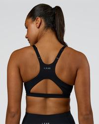 Woman wearing Luna Sports Bra - Black | Model:Rosie | Size:S