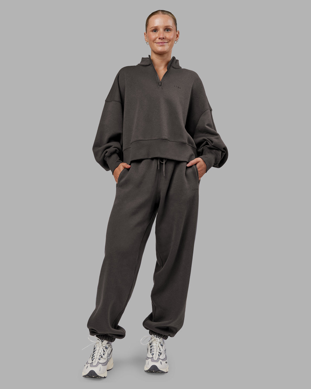Woman wearing MVP 1/2 Zip Oversized Sweater - Dark Storm | Model:Neve | Size:Dark Storm