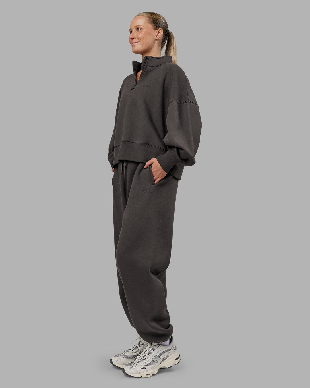 Woman wearing MVP 1/2 Zip Oversized Sweater - Dark Storm | Model:Neve | Size:Dark Storm