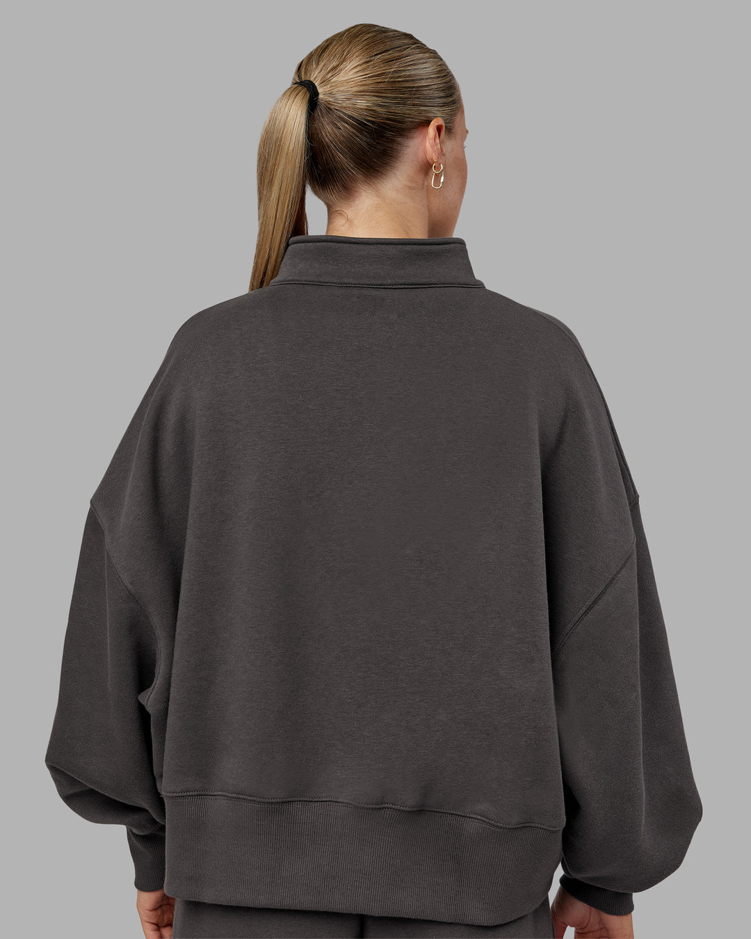 Woman wearing MVP 1/2 Zip Oversized Sweater - Dark Storm | Model:Neve | Size:Dark Storm