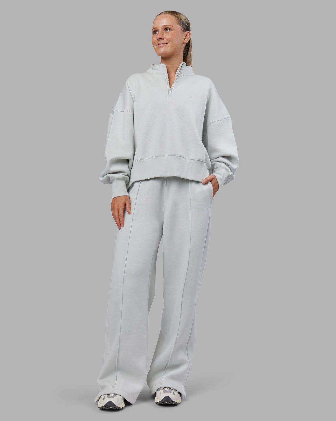 Woman wearing MVP 1/2 Zip Oversized Sweater - Digital Mist | Model:Neve | Size:S