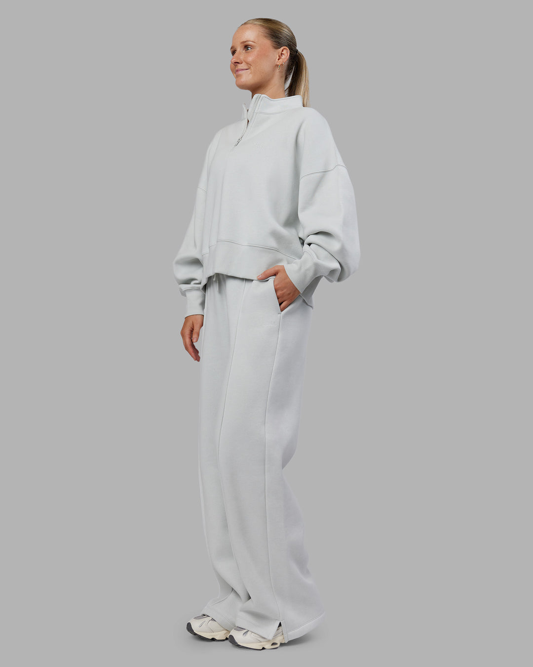Woman wearing MVP 1/2 Zip Oversized Sweater - Digital Mist | Model:Neve | Size:S