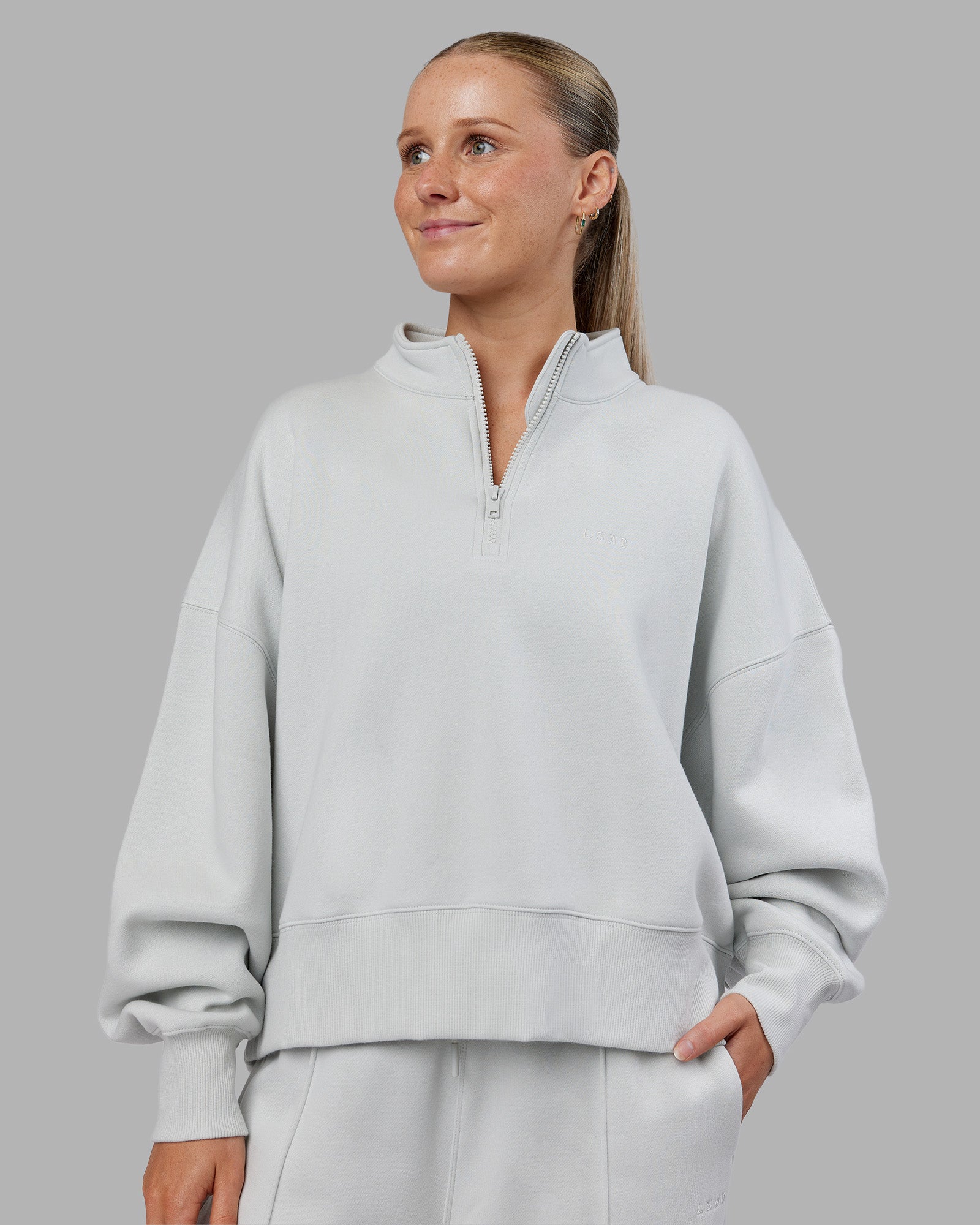 Woman wearing MVP 1/2 Zip Oversized Sweater - Digital Mist | Model:Neve | Size:S
