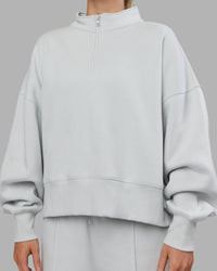 Woman wearing MVP 1/2 Zip Oversized Sweater - Digital Mist | Model:Neve | Size:S